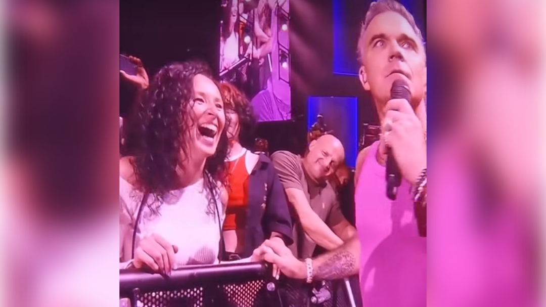 The pop star chatted with a fan during his concert on Tuesday.